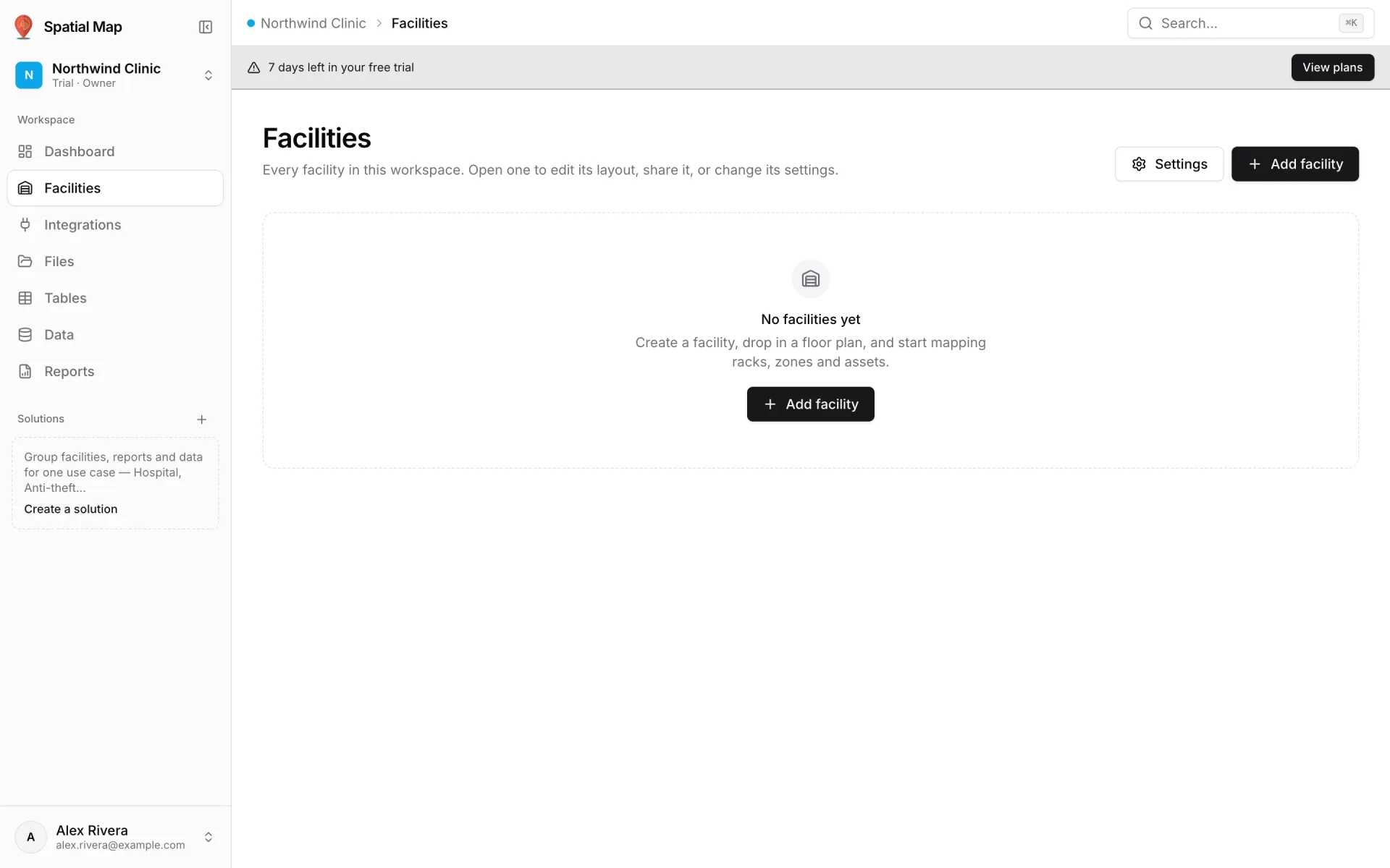 Empty Facilities screen in a new trial workspace with a 7 days left in your free trial banner, the No facilities yet message and an Add facility button