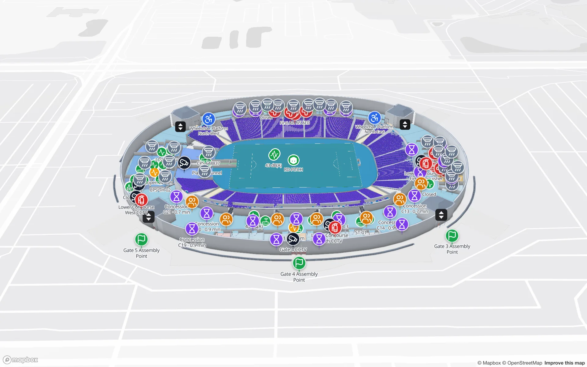 Crown Park Stadium im 3D-Viewer von Spatial Map: Spielfeld und blaue Sitzschüssel auf dem unteren Umlauf, mit Sammelpunkt-Fahnen vor den Toren, Erste-Hilfe- und AED-Markern, Kiosken, Personenzählern, Kameras und Aufzügen
